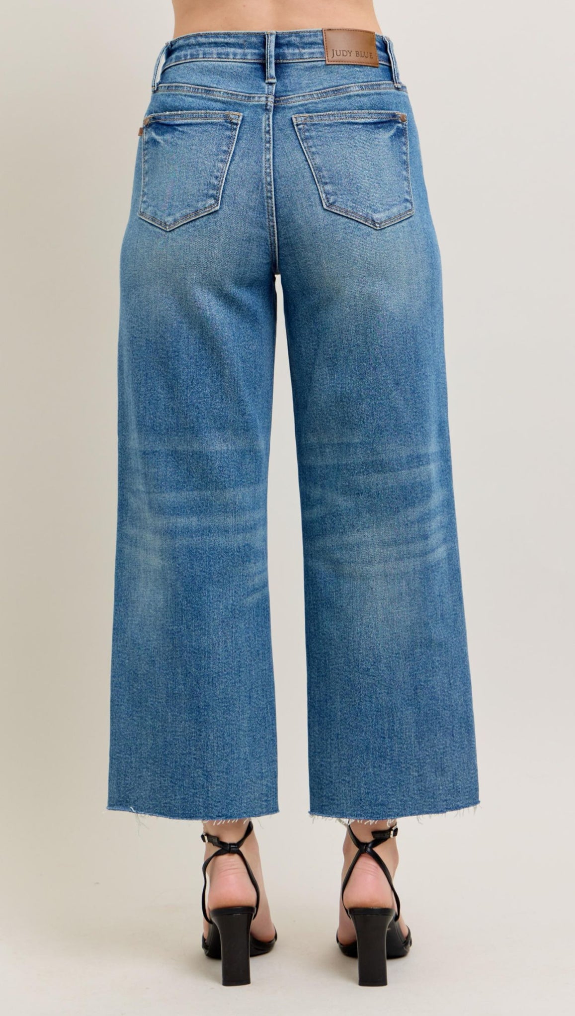 High Rise Medium Wash Distressed Hem Rigid Magic Cropped Wide Leg